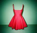 A-line mini dress with a slim waist and a bow tie